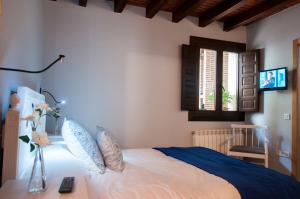 Posteľ alebo postele v izbe v ubytovaní Hotel Rural Princesa Kristina