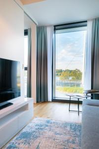TV a/nebo společenská místnost v ubytování Vienna Residence, Marina Tower - Danube