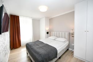 Posteľ alebo postele v izbe v ubytovaní Golden Mountain