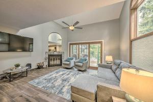 a living room with a couch and a fireplace at Dreamy, Family-Friendly Cloudcroft Townhome! in Cloudcroft