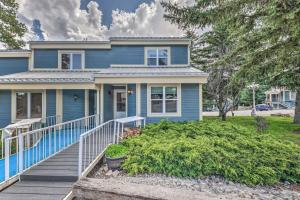 a blue house with a staircase in front of it at Dreamy, Family-Friendly Cloudcroft Townhome! in Cloudcroft