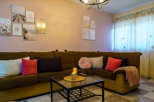 a living room with a couch and a table at Casa Rural Campoamor in Carboneras de Guadazaón