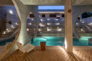 a house with a swimming pool and stairs at Casa TO - Adults Only in Puerto Escondido