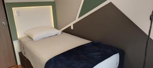 Postel nebo postele na pokoji v ubytování Allegro Polanco