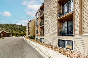 an empty street in front of a building at New Claim Condominiums 114 in Park City