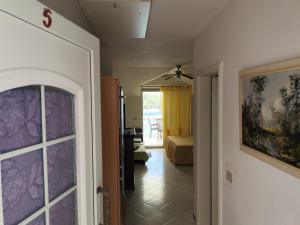 a hallway with a door leading to a bedroom at Apartments by the sea Cove Mikulina Luka, Korcula - 9181 in Vela Luka