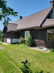 a house with a yard with a house at Białowieża 131 in Białowieża