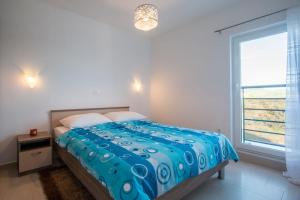 Postel nebo postele na pokoji v ubytování Apartment Verunic 14286d