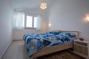 Postel nebo postele na pokoji v ubytování Apartment Verunic 14286d