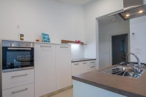 Kuchyň nebo kuchyňský kout v ubytování Apartment Verunic 14286d