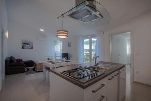 Kuchyň nebo kuchyňský kout v ubytování Apartment Verunic 14286d