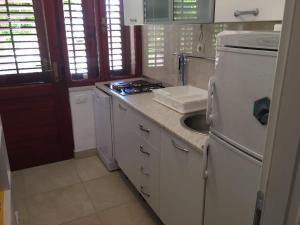A kitchen or kitchenette at Family friendly apartments with a swimming pool Bol, Brac - 14379