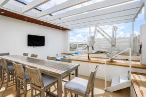 a dining room with a table and chairs at SoCe Flats 209 in Naples