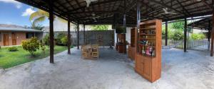 a pavilion with a table and chairs in a yard at Hermoso apartamento en condominio privado in Iquitos