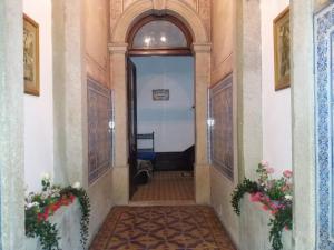 a hallway with a door in a building at Casa dragão in Porto