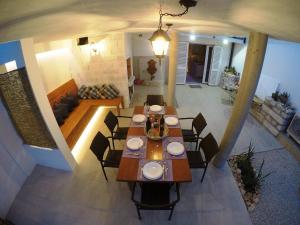 a dining room with a table and chairs in a house at Holiday house with a parking space Nin, Zadar - 14295 in Nin