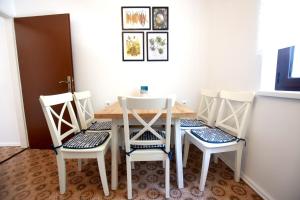 a dining room with a table and four chairs at Holiday house with a parking space Seline, Paklenica - 16318 in Starigrad