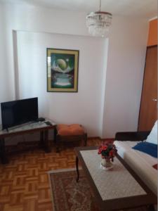 a living room with a couch and a table at Apartments with parking space Banjol, Rab - 16334 in Rab