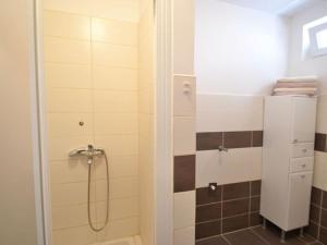 a bathroom with a shower with a shower curtain at Apartments by the sea Zadar - Diklo, Zadar - 16419 in Zadar