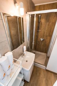a bathroom with a sink and a shower at Apartments with WiFi Pirovac, Sibenik - 16443 in Pirovac