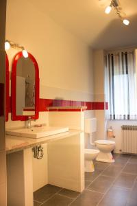 a bathroom with a toilet and a sink and a mirror at Apartments with a parking space Sutomiscica, Ugljan - 16524 in Preko