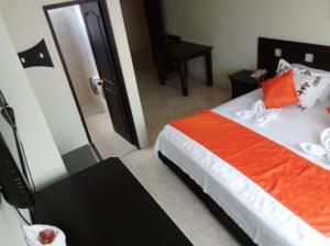 Ein Bett oder Betten in einem Zimmer der Unterkunft Hotel El Sueño De J.E.