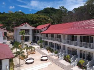 an overhead view of the courtyard of a resort with red roofs at Stunning Republic in El Nido