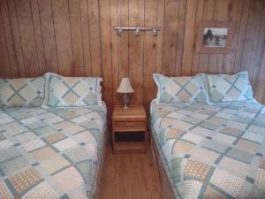 Voodi või voodid majutusasutuse Rocky Mountain Inn toas