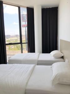 Postel nebo postele na pokoji v ubytování M Design Hotel@KLIA,Sepang