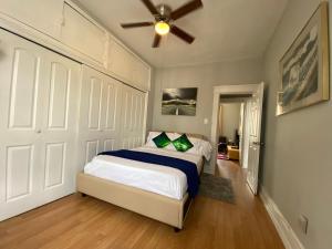 a bedroom with a bed and a ceiling fan at Lovely Cozy apt West NY NJ Excellent transportation 12 minutes to NY 7 minutes at NYWater Way Ferry in West New York