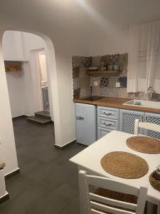 A kitchen or kitchenette at Ονειρόπετρα Λέρος~Oneiropetra Leros