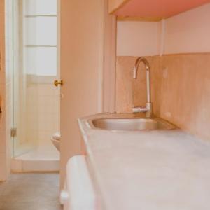 a bathroom with a tub and a sink and a toilet at Nasos Corfu Town Apartment in Corfu Town