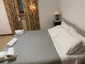 Voodi või voodid majutusasutuse Hotel Le Logge toas