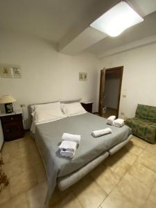 Voodi või voodid majutusasutuse Hotel Le Logge toas
