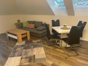 a living room with a couch and a table at Sorinas Home - Comfortable Apartment near Graz - Free Parking in Wagersbach