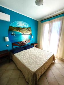 A bed or beds in a room at Puesta De Sol Residence