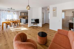 a living room with a couch and a table at Chalet Altalmrich in Naumburg