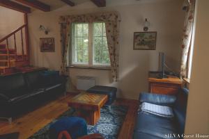 Posezení v ubytování SILVA Guest House - dom wczasowy, tenis, basen, balia i sauna
