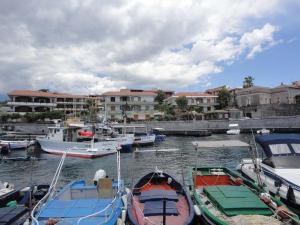 a group of boats are docked in a harbor at Acirealevacanze - Romantica Camera sul Mare in Acireale