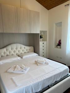 Posteľ alebo postele v izbe v ubytovaní La Casina degli Ulivi