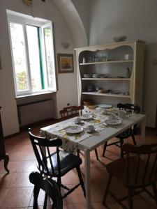 a dining room with a table and some chairs at la vecchia locanda in Vietri sul Mare