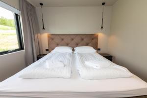 Krevet ili kreveti u jedinici u okviru objekta Hotel North