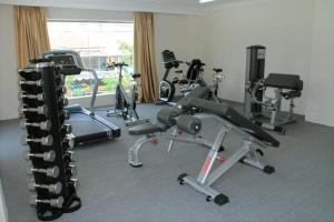 a gym with several exercise bikes in a room at Nha Trang Palace Hotel in Nha Trang