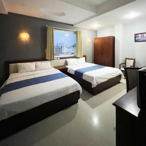 Postel nebo postele na pokoji v ubytování Ocean Bay Hotel