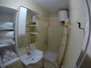 a bathroom with a shower and a sink at VuBra in Ulcinj +14 photos