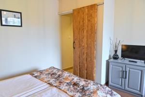 Postel nebo postele na pokoji v ubytování Klecherova House