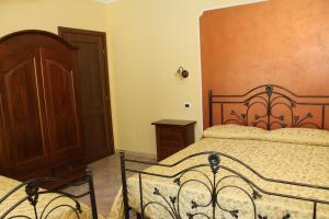 Postel nebo postele na pokoji v ubytování Agriturismo La Gemma del Parco