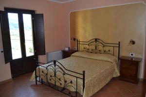 Postel nebo postele na pokoji v ubytování Agriturismo La Gemma del Parco