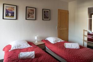 Łóżko lub łóżka w pokoju w obiekcie Apartment Les Alpages
