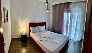 Postel nebo postele na pokoji v ubytování A&D City Apartment